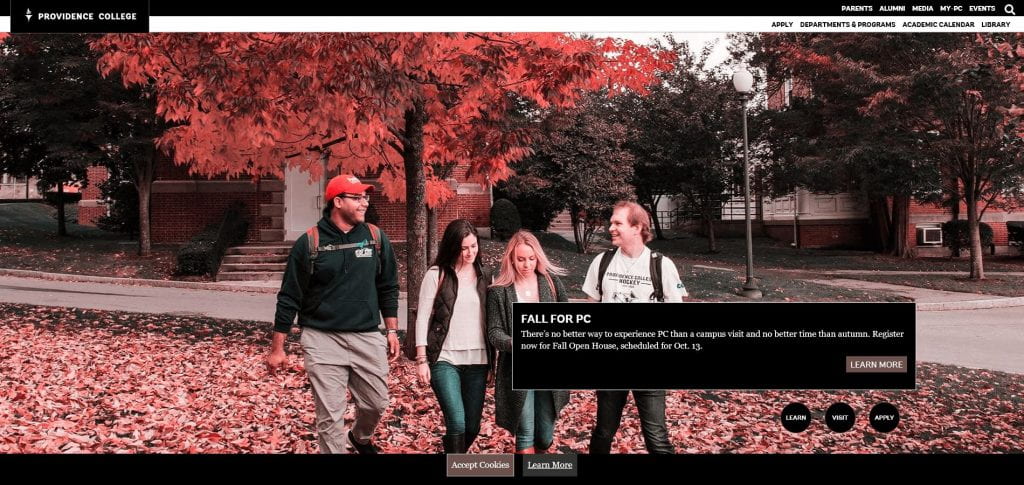 red-tinted image of four students walking
