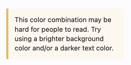 Screenshot of an alert that says "This color combination may be hard for people to read. Try using a brighter background color and/or a darker text color."